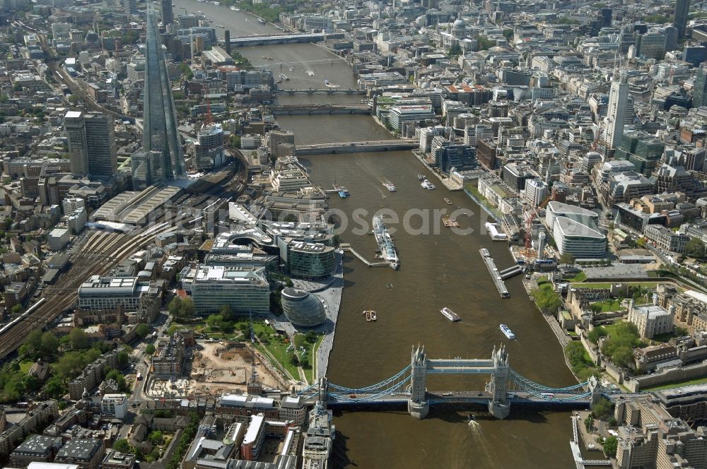 Aerial photograph London - City view of downtown central London at Tower Bridge along the banks of the Thames