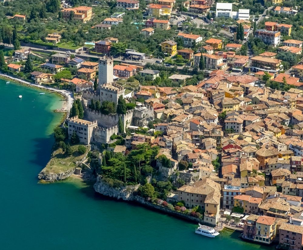 Malcesine from the bird's eye view: City view of Malcesine with the castle Castello di Malcesine at the Garda sea in Veneto, Italy