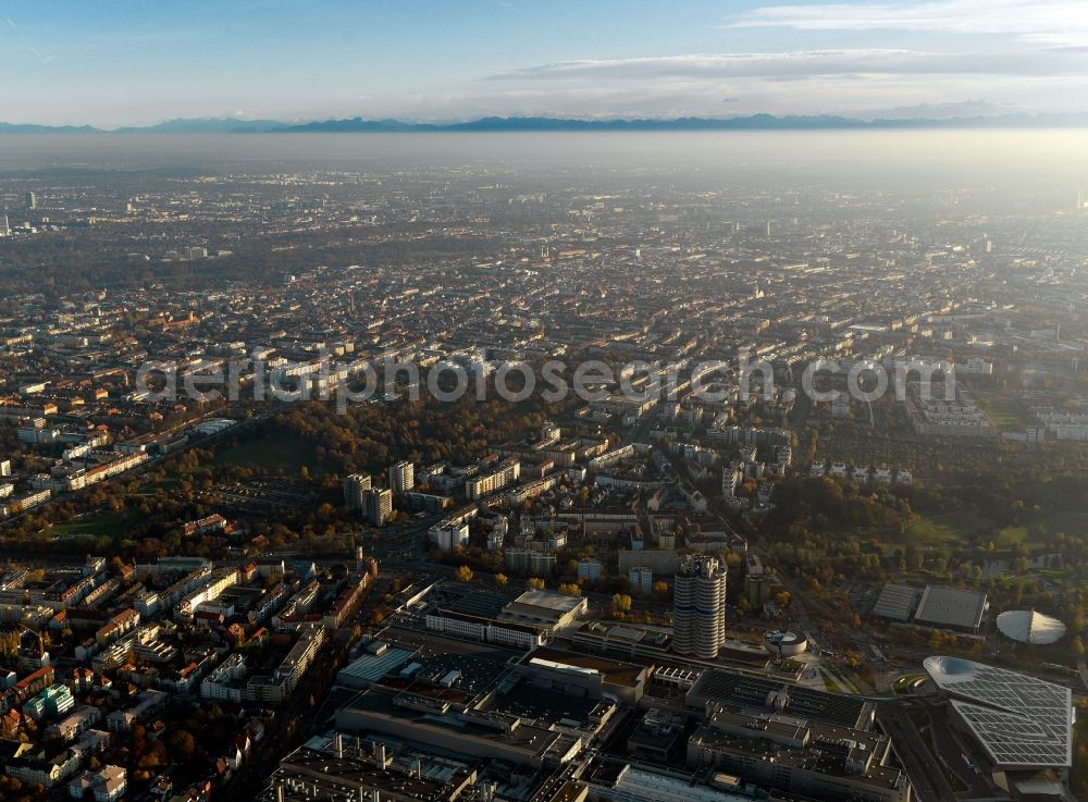 Aerial photograph München - Cityscape of Munich in the free state of Bavaria. In the foreground lies the Olympic Park, one of the landmark sites of the city. Located in the background are the city of Munich and mountains of the Alps