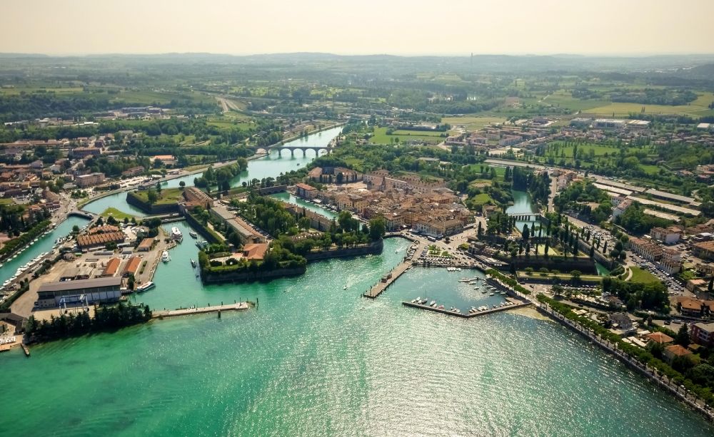 Peschiera del Garda from the bird's eye view: City view of Peschiera del Garda in the province Verona in Italy. The City is locaded at the southern bank of the Gardasee. Also the Mincio river flows into the Gardasee