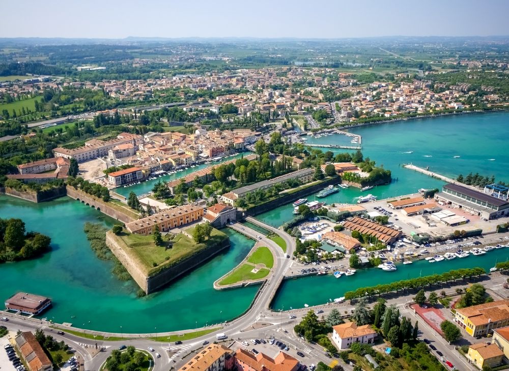 Peschiera del Garda from the bird's eye view: City view of Peschiera del Garda in the province Verona in Italy. The City is locaded at the southern bank of the Gardasee. Also the Mincio river flows into the Gardasee