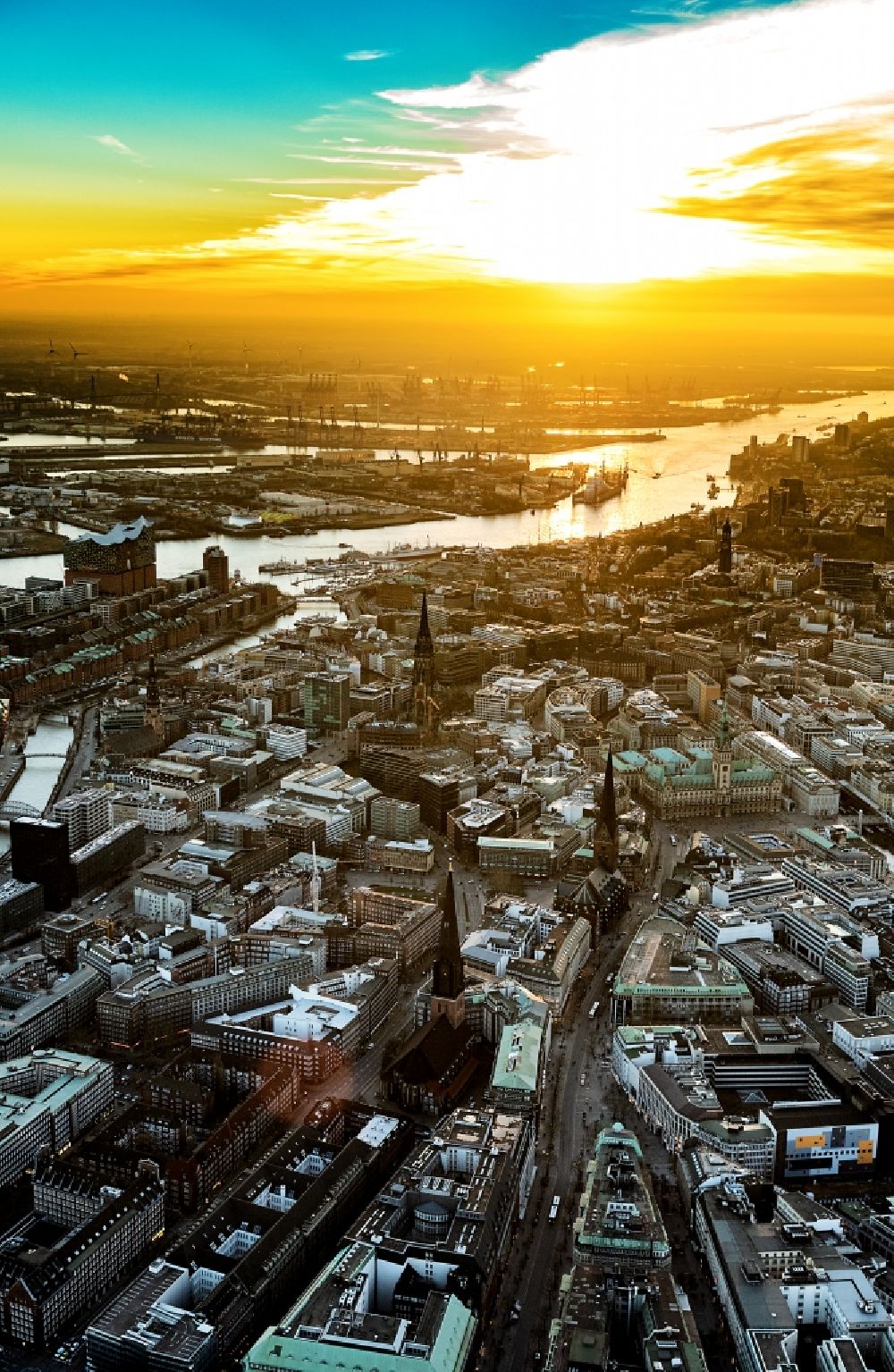 Hamburg from the bird's eye view: City view on the river bank of the River Elbe, by sunset, in the district HafenCity in Hamburg, Germany