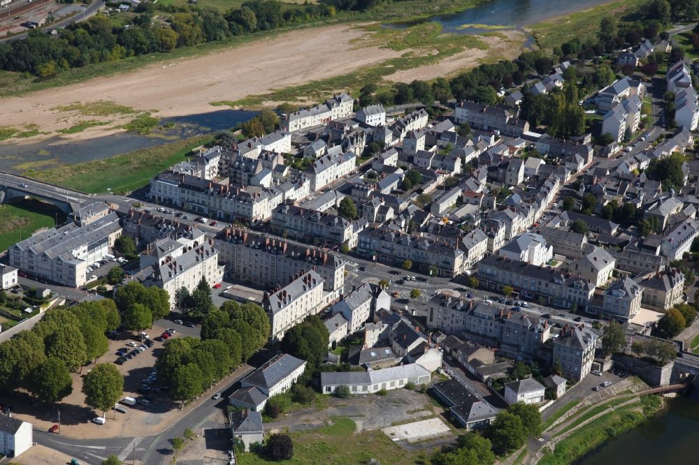 Aerial image Saumur - City view on the river bank of the Loire in Saumur in Pays de la Loire, France, A part of the town is located on the island of Ile d' Offard in the Loire
