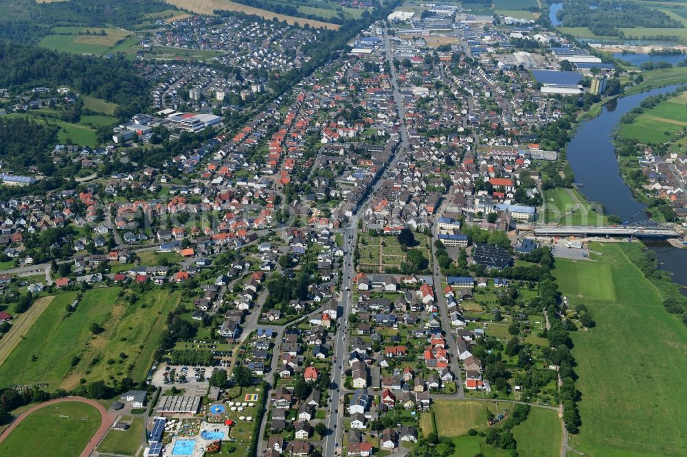 Beverungen from above - City view on the river bank of the Weser river in Beverungen in the state North Rhine-Westphalia, Germany