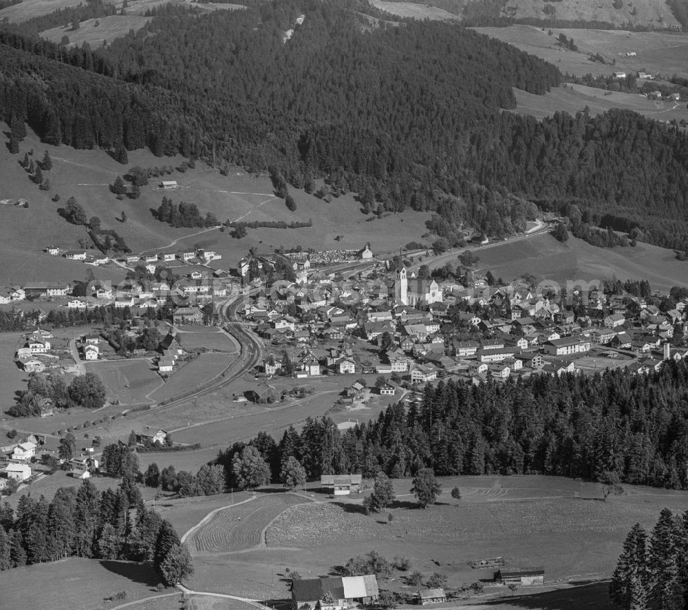 Oberstaufen from above - City view of the inner city area in the valley surrounded by mountains in Allgaeu in Oberstaufen in the state Bavaria, Germany