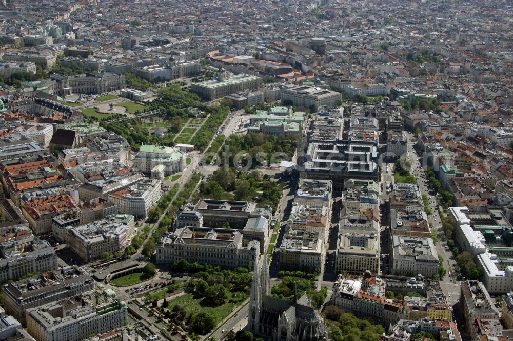 Wien from the bird's eye view: View over the Votive Church in the Alsergrund district onto the inner city district with sights e.g. the University, the City Hall Park, Vienna City Hall, the Houses of Parliament, the Castle theatre, the Palace of Justice, the Natural History Museum, the Marie-Theresa Square, the Museum of Fine Arts, the Castle Garden, Heroes Square, the People`s Garden, Imperial Palace in Vienna in Austria
