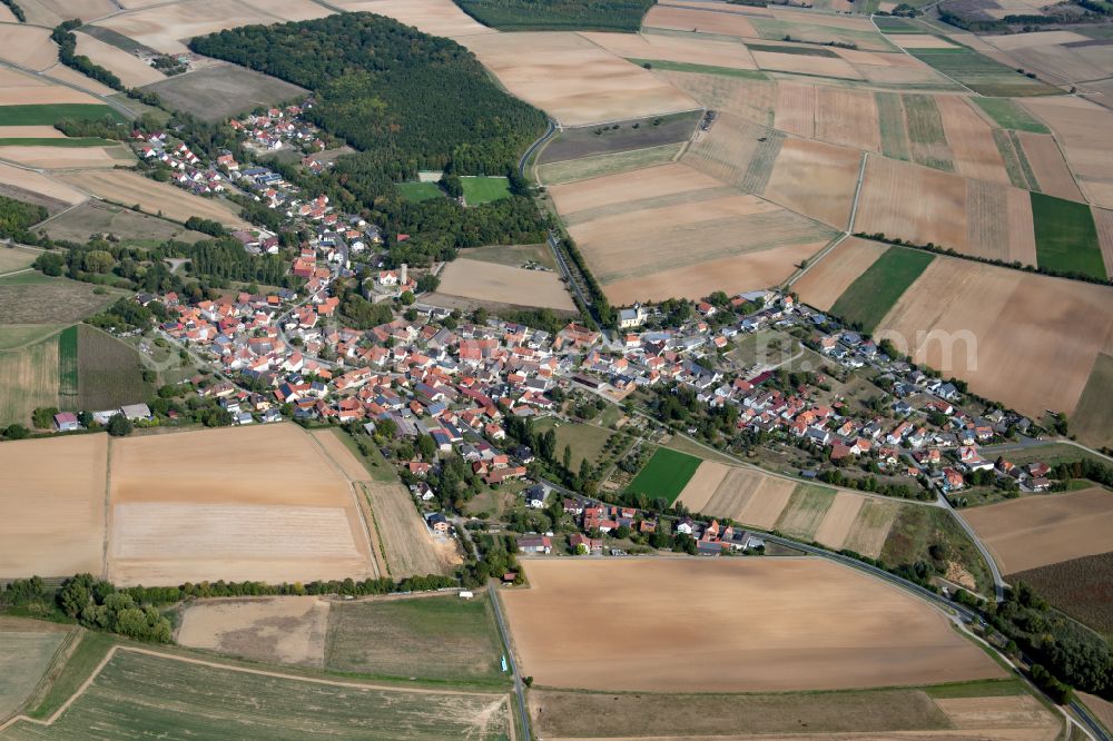 Büchold from the bird's eye view: Urban area with outskirts and inner city area on the edge of agricultural fields and arable land in Büchold in the state Bavaria, Germany