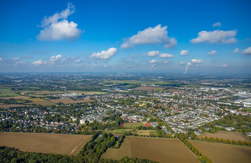 Holzwickede from the bird's eye view: Urban area with outskirts and inner city area on the edge of agricultural fields and arable land in Holzwickede at Ruhrgebiet in the state North Rhine-Westphalia, Germany