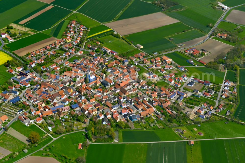 Hüttenheim from above - Urban area with outskirts and inner city area on the edge of agricultural fields and arable land in Hüttenheim in the state Bavaria, Germany