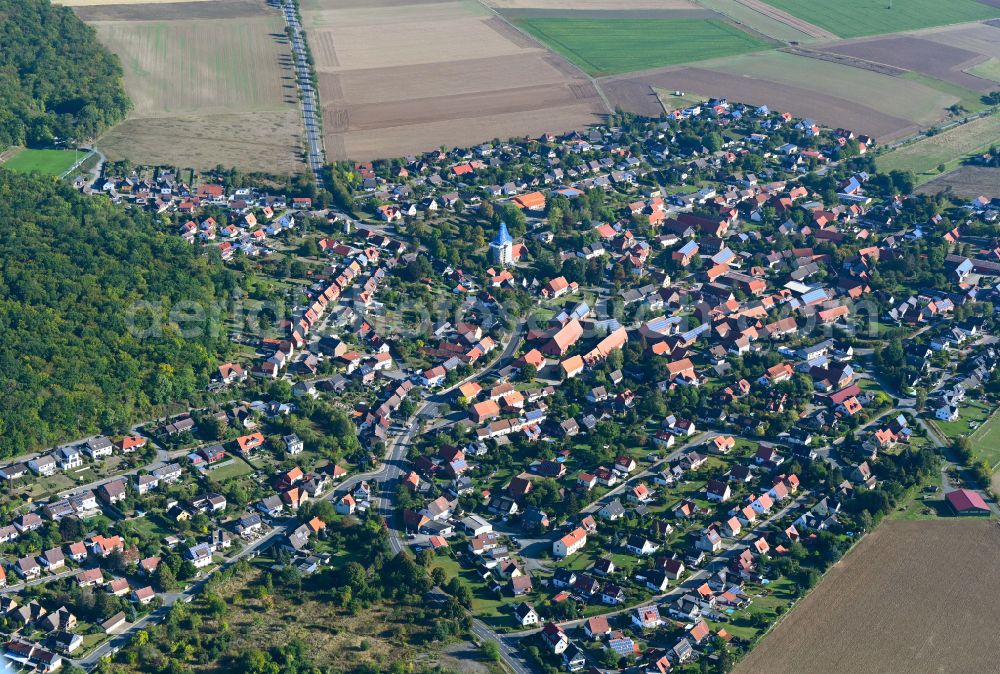 Immenrode from above - Urban area with outskirts and inner city area on the edge of agricultural fields and arable land in Immenrode in the state Lower Saxony, Germany