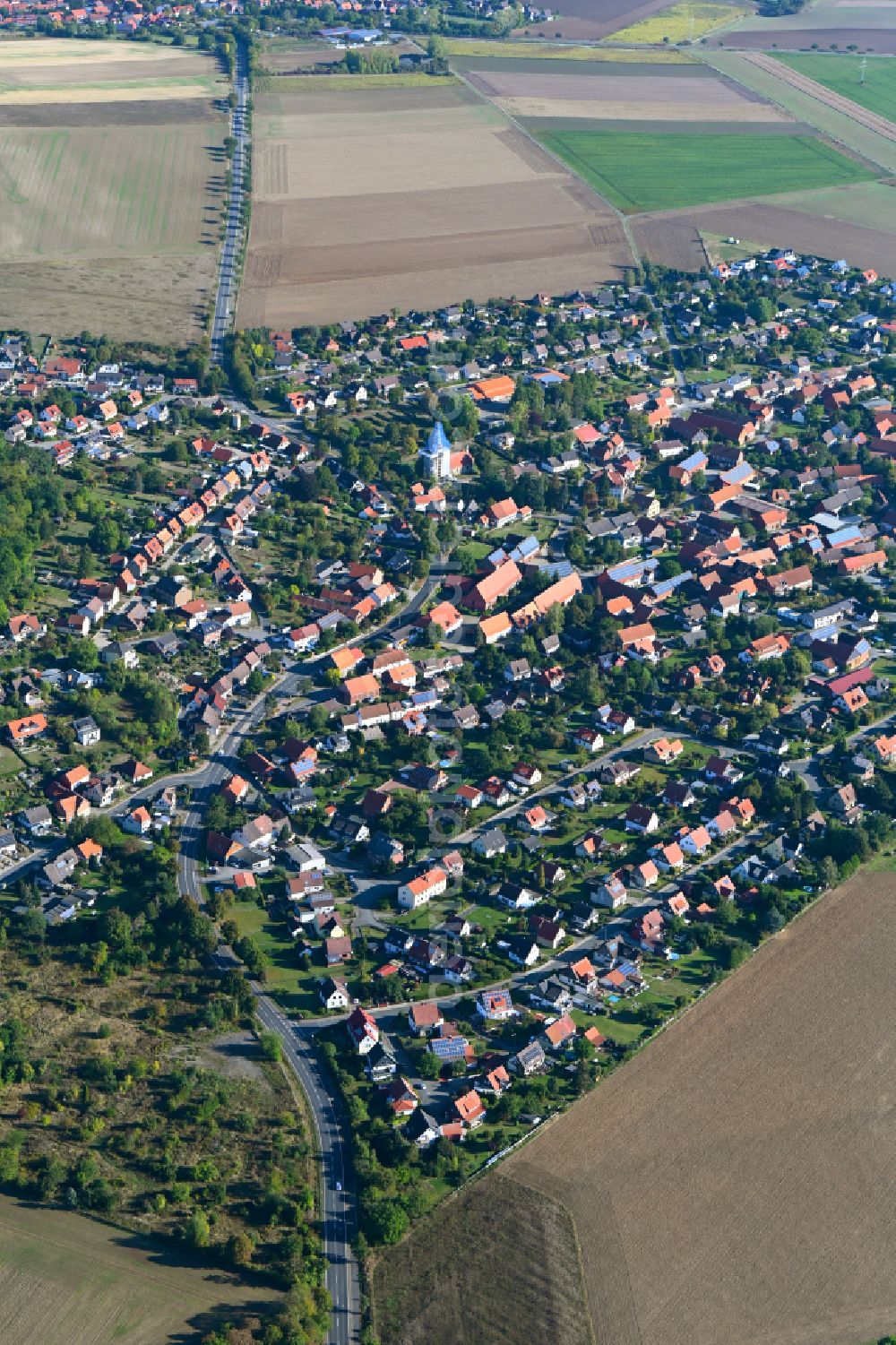 Immenrode from the bird's eye view: Urban area with outskirts and inner city area on the edge of agricultural fields and arable land in Immenrode in the state Lower Saxony, Germany