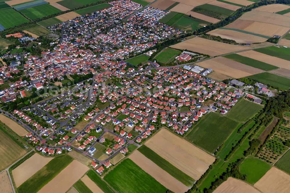 Kürnach from the bird's eye view: Urban area with outskirts and inner city area on the edge of agricultural fields and arable land in Kürnach in the state Bavaria, Germany