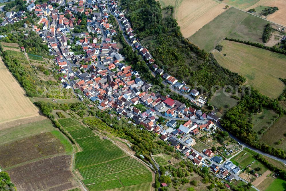 Aerial image Laudenbach - Urban area with outskirts and inner city area on the edge of agricultural fields and arable land in Laudenbach in the state Bavaria, Germany