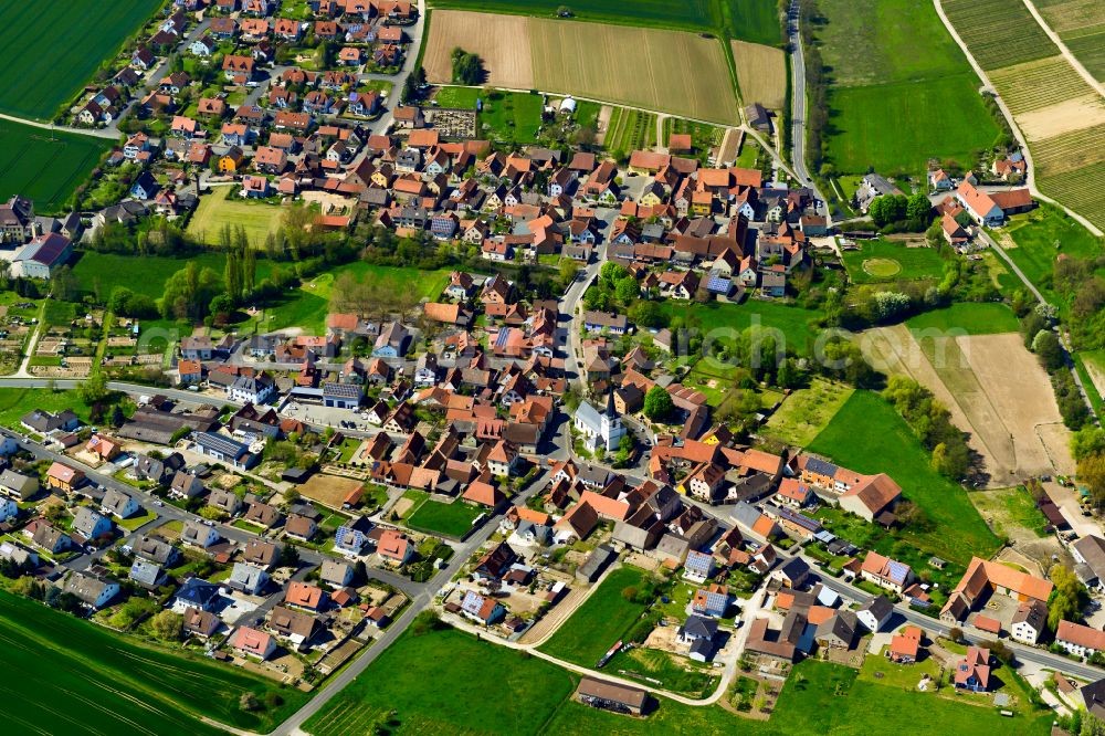 Aerial image Obervolkach - Urban area with outskirts and inner city area on the edge of agricultural fields and arable land in Obervolkach in the state Bavaria, Germany