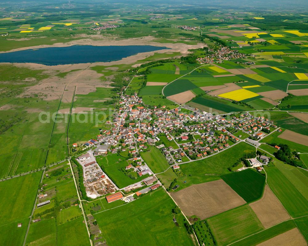 Aerial image Oggelshausen - Urban area with outskirts and inner city area on the edge of agricultural fields and arable land in Oggelshausen in the state Baden-Wuerttemberg, Germany