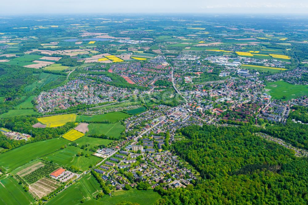Schwarzenbek from the bird's eye view: Urban area with outskirts and inner city area on the edge of agricultural fields and arable land in Schwarzenbek in the state Schleswig-Holstein, Germany