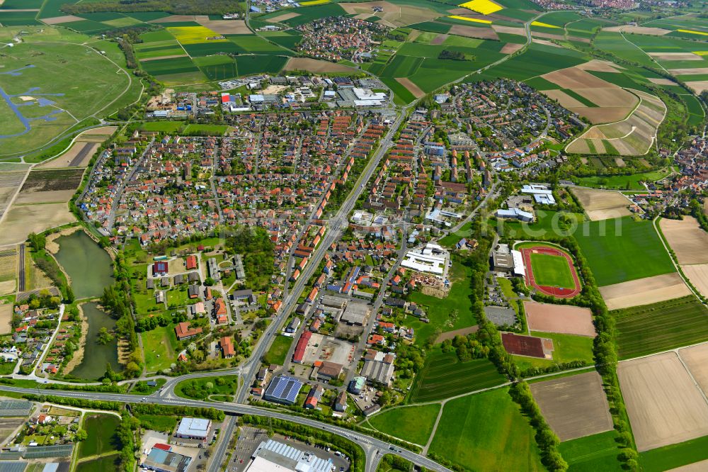 Siedlung from the bird's eye view: Urban area with outskirts and inner city area on the edge of agricultural fields and arable land in Siedlung in the state Bavaria, Germany