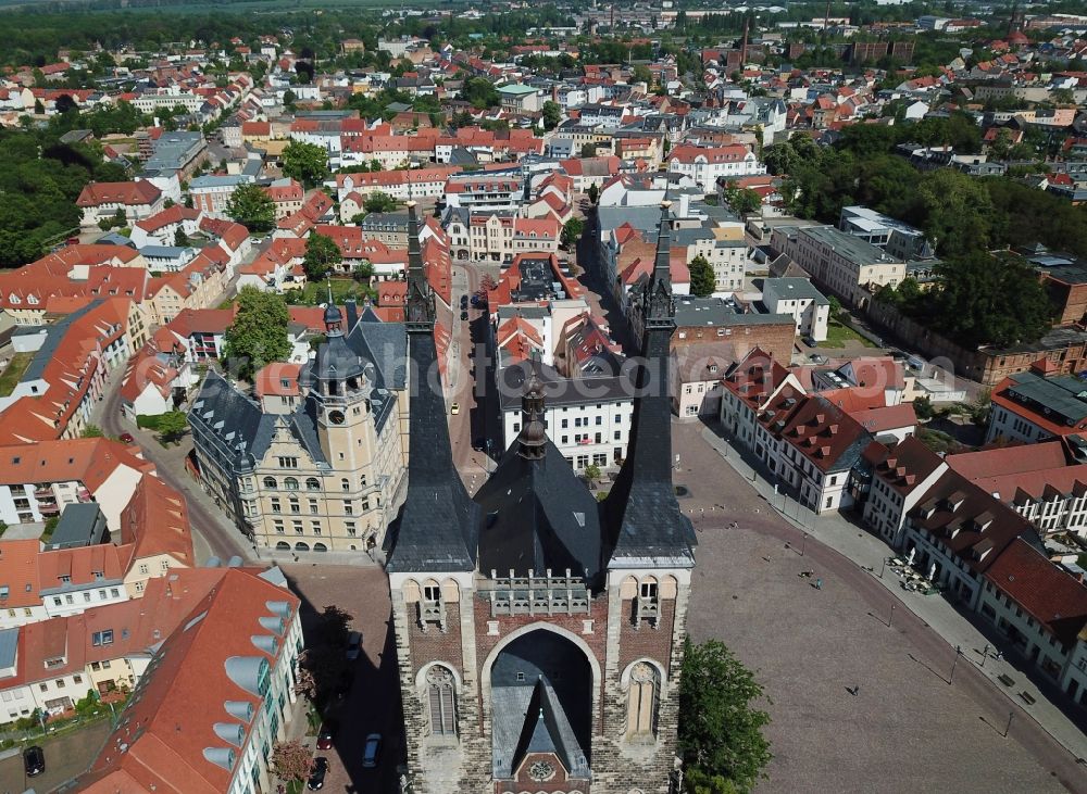 Köthen (Anhalt) from the bird's eye view: Church of Saint Jakob and town hall of Koethen (Anhalt) in the state of Saxony-Anhalt. A tower and parts of the town hall are scaffolded and being renovated