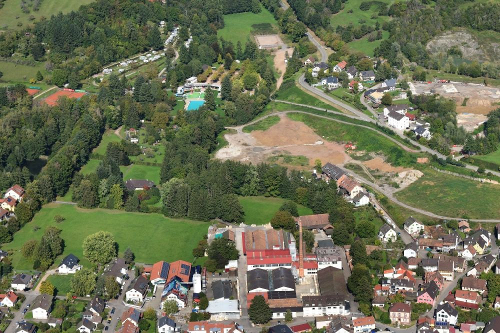 Kandern from above - Outskirts residential area with biotope, habitats and lakes in the area of the former clay pit in Kandern in the state Baden-Wurttemberg, Germany