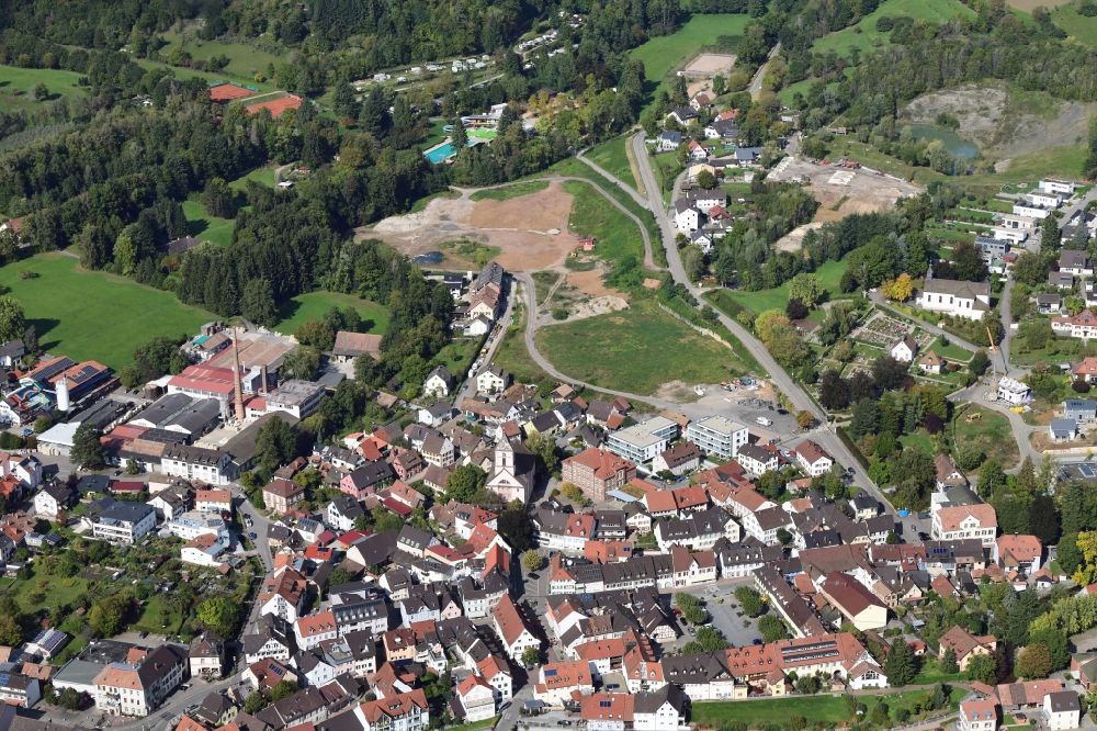 Kandern from the bird's eye view: Outskirts residential area with biotope, habitats and lakes in the area of the former clay pit in Kandern in the state Baden-Wurttemberg, Germany