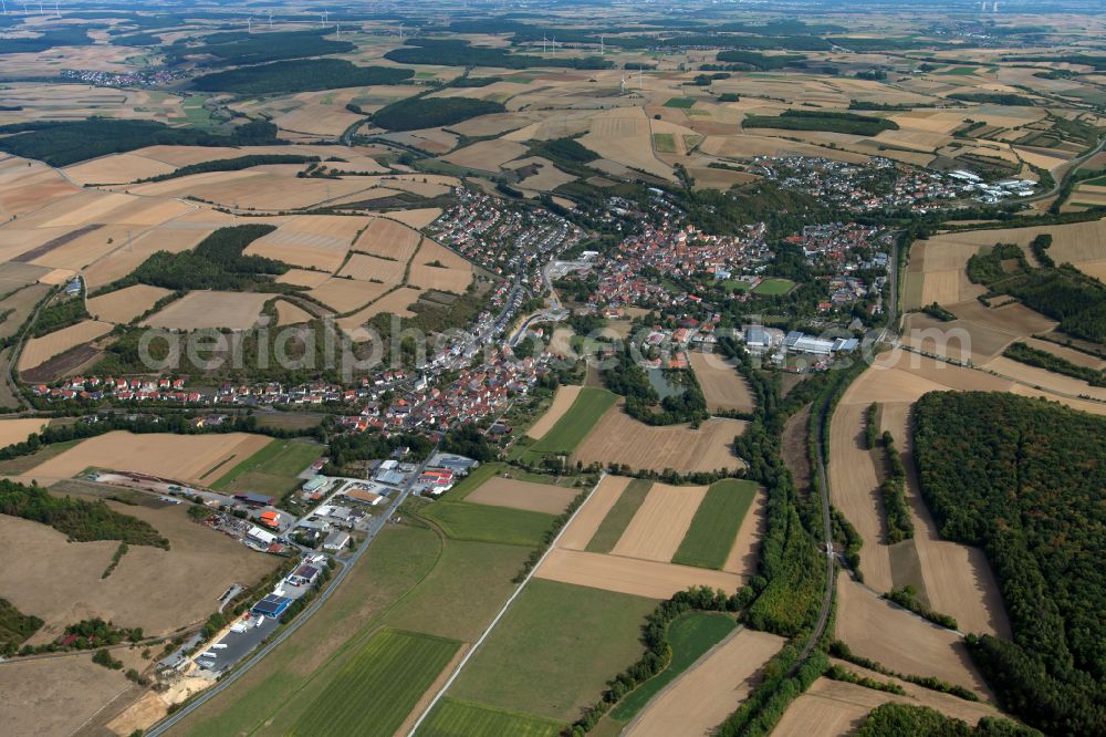 Arnstein from above - City view from the outskirts with adjacent agricultural fields in Arnstein in the state Bavaria, Germany