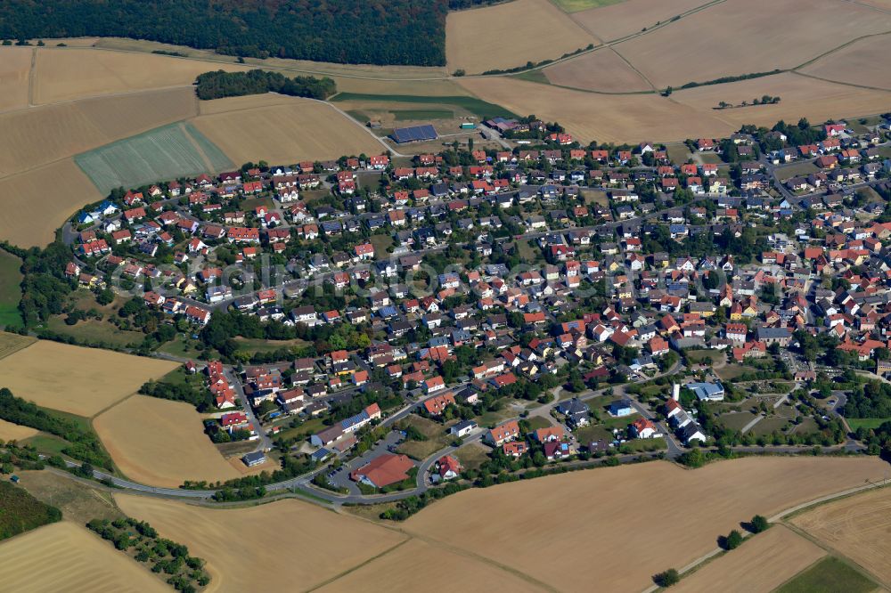 Eisingen from the bird's eye view: City view from the outskirts with adjacent agricultural fields in Eisingen in the state Bavaria, Germany