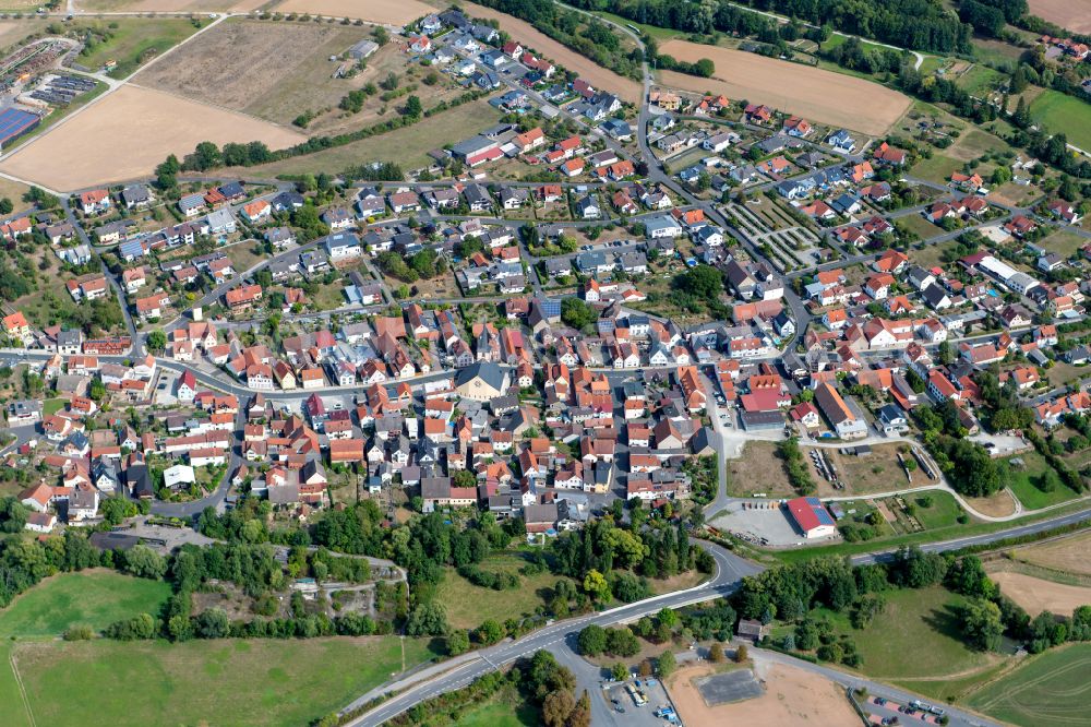 Gössenheim from the bird's eye view: City view from the outskirts with adjacent agricultural fields in Goessenheim in the state Bavaria, Germany