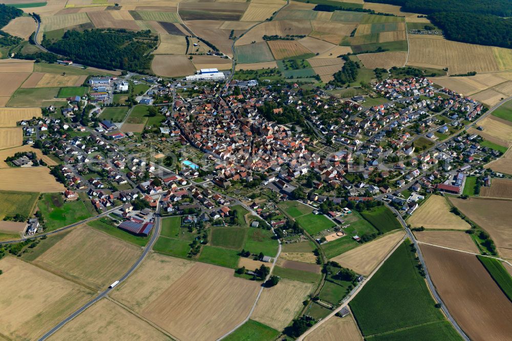 Neubrunn from above - City view from the outskirts with adjacent agricultural fields in Neubrunn in the state Bavaria, Germany