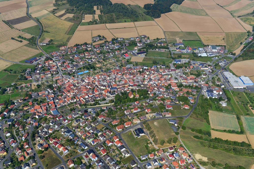 Aerial image Neubrunn - City view from the outskirts with adjacent agricultural fields in Neubrunn in the state Bavaria, Germany