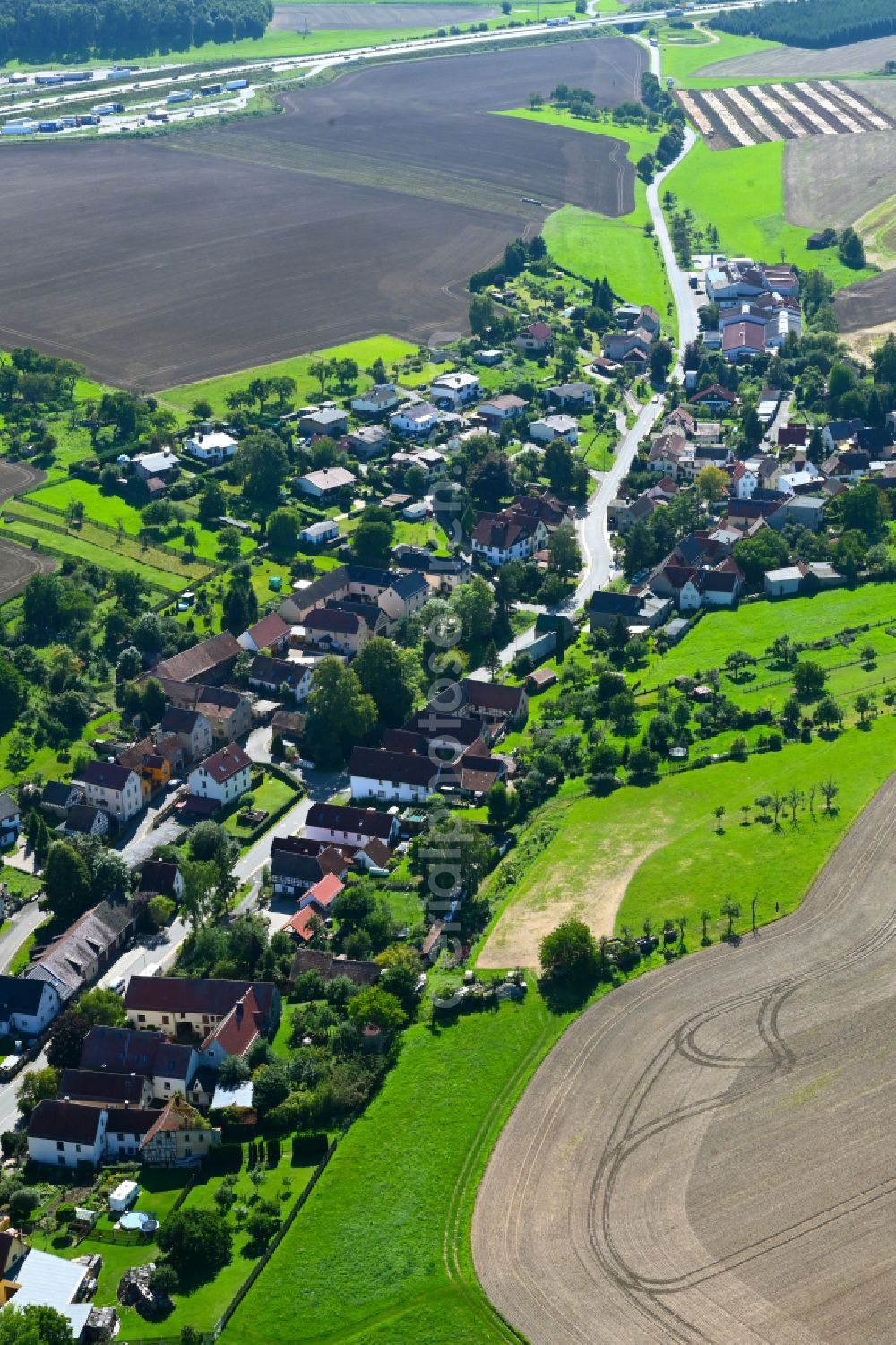 Rüdersdorf from the bird's eye view: City view from the outskirts with adjacent agricultural fields in Ruedersdorf in the state Thuringia, Germany