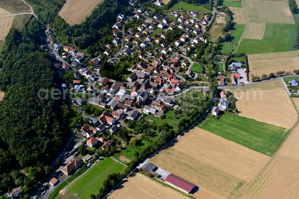 Roßbrunn from above - City view from the outskirts with adjacent agricultural fields in Roßbrunn in the state Bavaria, Germany