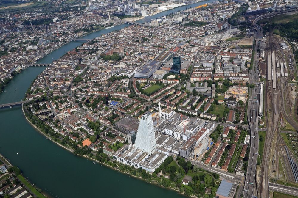 Aerial photograph Basel - On the right hand of the River Rhine is Kleinbasel, an urban area of Basel in Switzerland with the fair district and the new impressive Roche tower