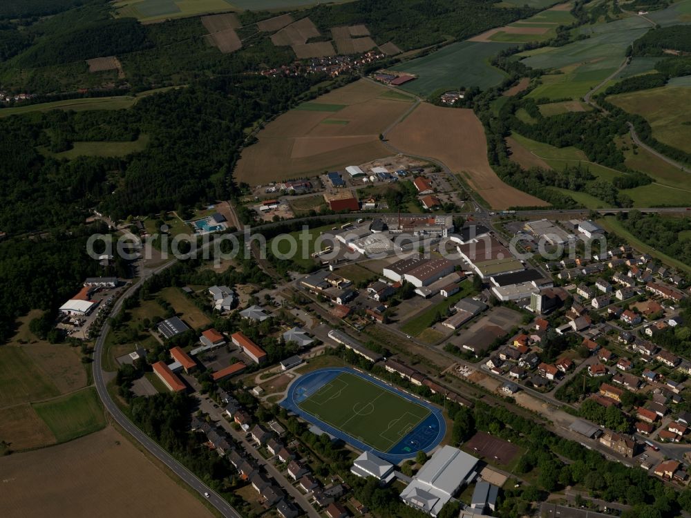 Aerial photograph Meisenheim - Partial view of Meisenheim in the state of Rhineland-Palatinate. Meisenheim is a town and municipiality in the county district of Bad Kreuznach. It is an official spa and health resort. The town is located on the federal highway B420, in the valley of the river Glan near the North Palatinate Mountain region. Sports facilities, a football pitch and residential buildings and estates are located in the West of the town on B420 and Praeses-Held-Street