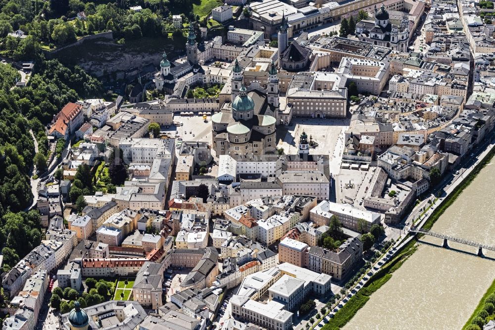 Salzburg from above - City center in the downtown area on the banks of river course of Salzach in Salzburg in Austria