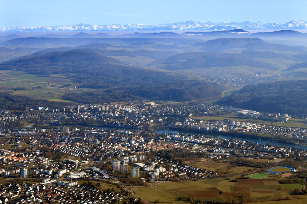 Rheinfelden (Baden) from above - City center on the banks of river Rhine in Rheinfelden (Baden) in the state Baden-Wurttemberg, Germany. Looking over the Swiss Jura mountains to the mountain range of the snow covered Swiss Alps