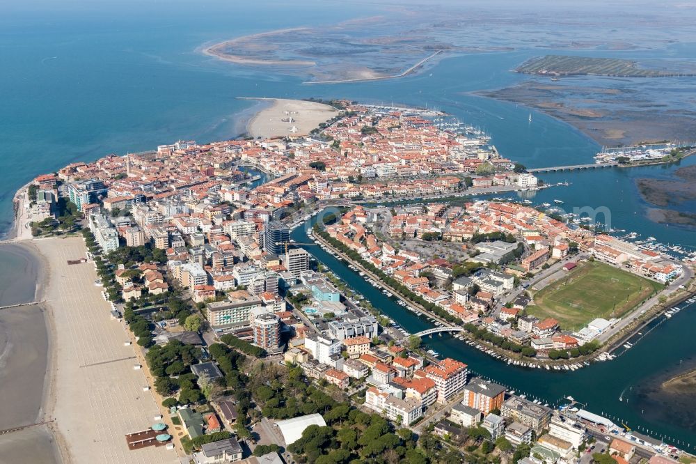 Grado from above - Beach and hotel development on the peninsula at the adriatic coast in Grado in Friuli-Venezia Giulia, Italy