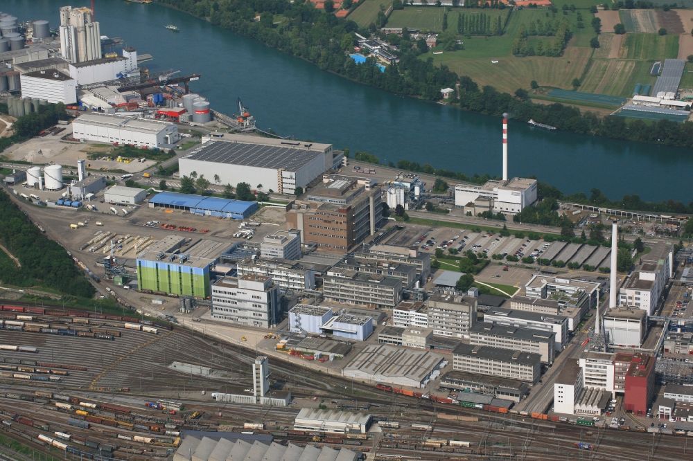 Muttenz from above - Buildings and production halls on the premises of the industrial park Infrapark Baselland AG in Muttenz in the canton Basel-Landschaft, Switzerland