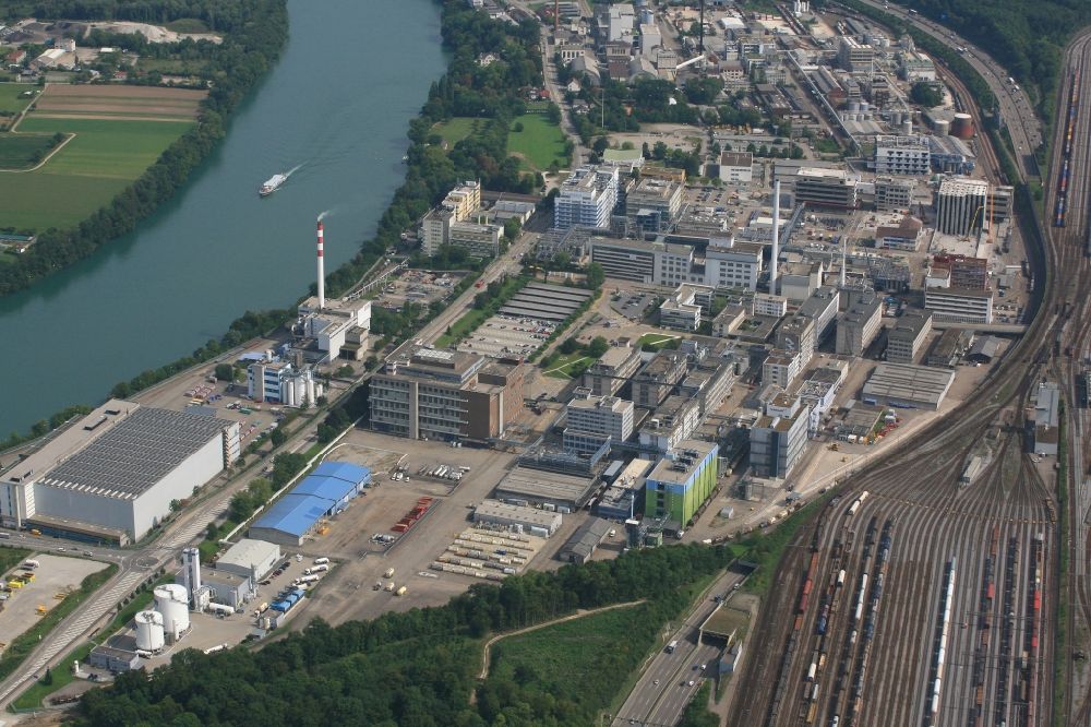 Aerial photograph Muttenz - Buildings and production halls on the premises of the industrial park Infrapark Baselland AG in Muttenz in the canton Basel-Landschaft, Switzerland