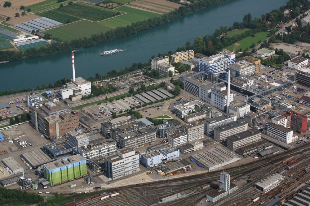 Muttenz from above - Buildings and production halls on the premises of the industrial park Infrapark Baselland AG in Muttenz in the canton Basel-Landschaft, Switzerland