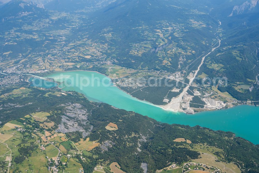 Crots from the bird's eye view: Impoundment and shore areas at the lake Lac de Serre-Poncon in Crots in Provence-Alpes-Cote d'Azur, France