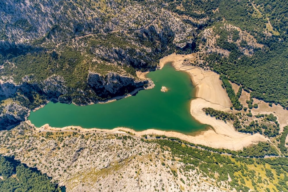 Aerial image Escorca - Impoundment and shore areas at the lake Gorg Blau in Escorca at Serra de Tramuntana in Balearic island of Mallorca, Spain