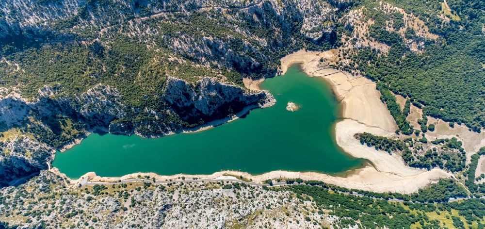 Fornalutx from above - Impoundment and shore areas at the lake CA?ber - Embassament de CA?ber in the mountains next to the Puig Major mountain in Fornalutx in Balearic islands, Spain
