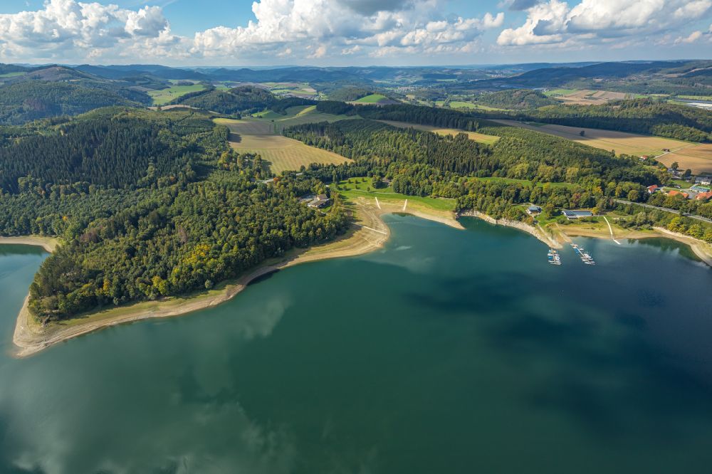 Meschede from above - Impoundment and shore areas at the lake Hennesee in Meschede in the state North Rhine-Westphalia, Germany