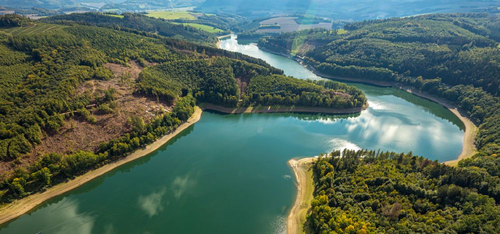 Meschede from above - Impoundment and shore areas at the lake Hennesee in Meschede in the state North Rhine-Westphalia, Germany