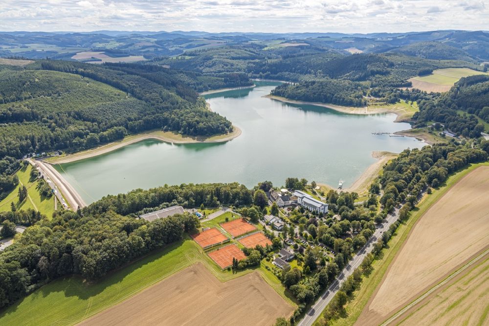 Meschede from above - Shore areas and dam at the reservoir Hennesee in Meschede in the state North Rhine-Westphalia, Germany