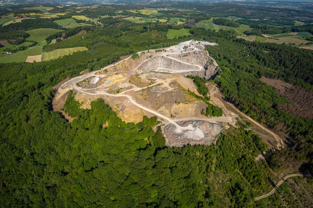 Arnsberg from the bird's eye view: Quarry for the mining and handling of limestone of Heinrich Ebel GmbH & Co. KG in Arnsberg in the state North Rhine-Westphalia, Germany