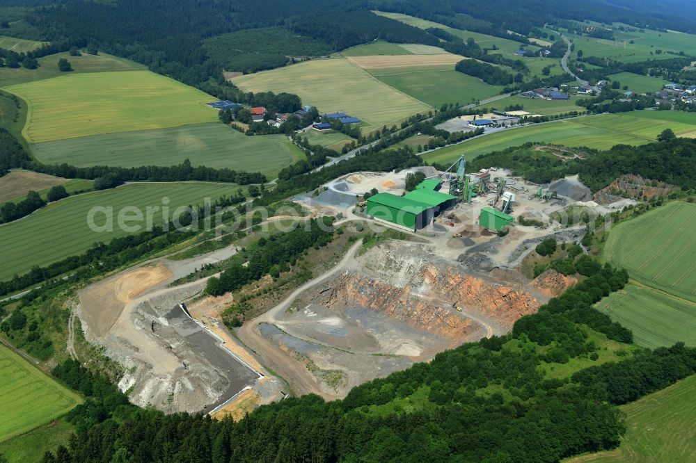 Sundern (Sauerland) from the bird's eye view: Quarry for the mining and handling of limestone in the district Hellefeld in Sundern (Sauerland) in the state North Rhine-Westphalia, Germany