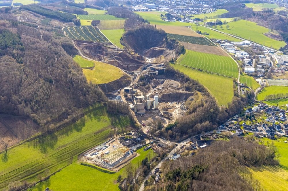 Westenfeld from the bird's eye view: Quarry for the mining and handling of limestone of the asphalt mixing plant Deutsche Asphalt GmbH in Westenfeld at Sauerland in the state North Rhine-Westphalia, Germany