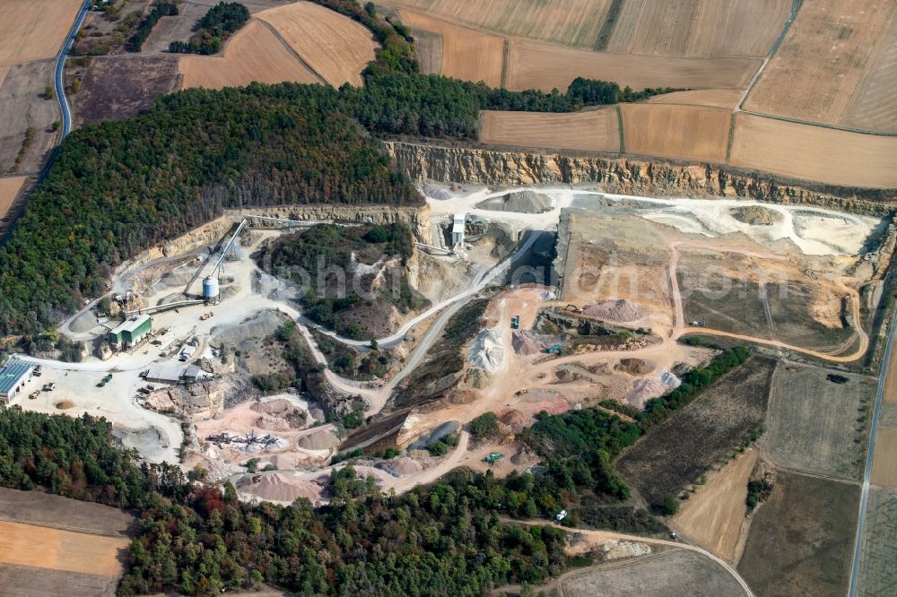 Karlstadt from the bird's eye view: Quarry for the mining and handling of gravel of the Emil Vaeth GmbH Schotterwerk and Bauschuttrecycling Am Schotterwerk in Karlstadt in the state Bavaria, Germany