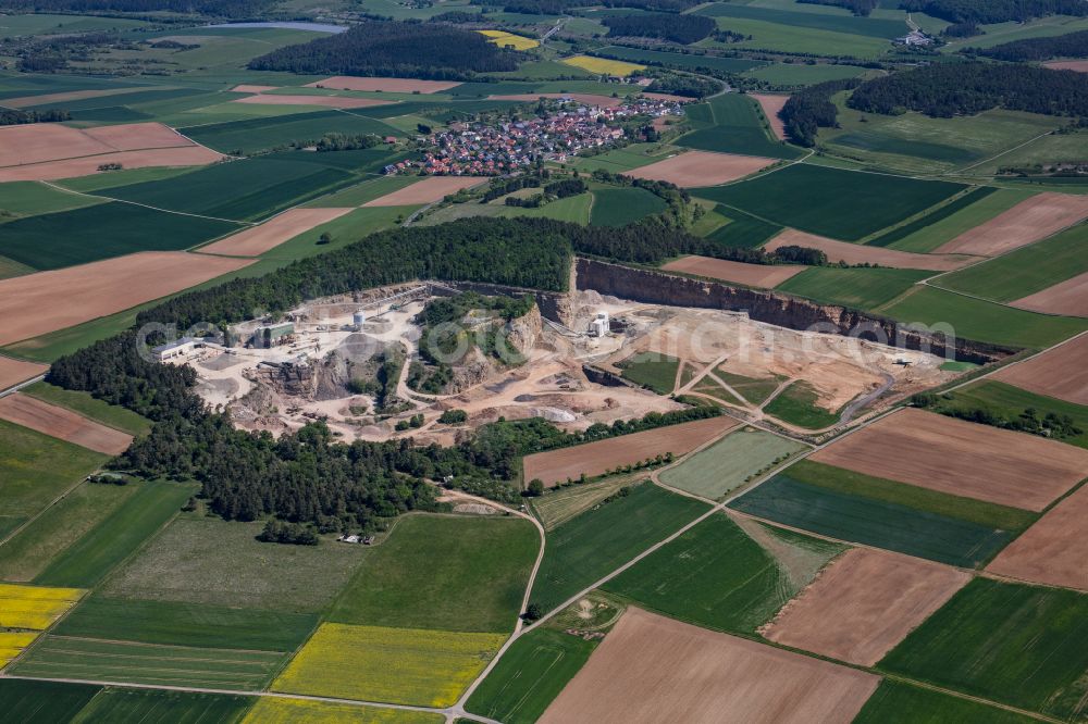 Karlstadt from the bird's eye view: Quarry for the mining and handling of gravel of the Emil Vaeth GmbH Schotterwerk and Bauschuttrecycling Am Schotterwerk in Karlstadt in the state Bavaria, Germany